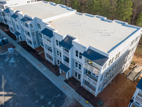 Professional Aerial Drone Photo of An Apartment Building Under Construction With A TPO Roof: Architecture, Construction, Industry, Real Estate