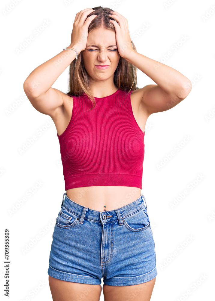 Young beautiful blonde woman wearing elegant summer shirt suffering from headache desperate and stressed because pain and migraine. hands on head. Young beautiful blonde woman wearing elegant summer shirt suffering from headache desperate and stressed because pain and migraine. hands on head.