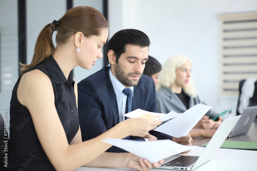 Business People, Successful business professionals. Diverse team celebrating business success at meeting. Business People, Successful business professionals. Diverse team celebrating business success at meeting.