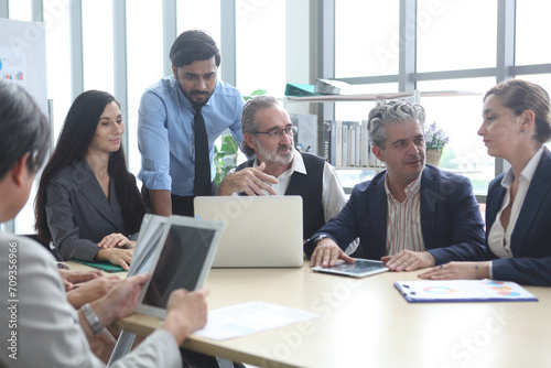 Business People, Successful business professionals. Diverse team celebrating business success at meeting. © sittinan