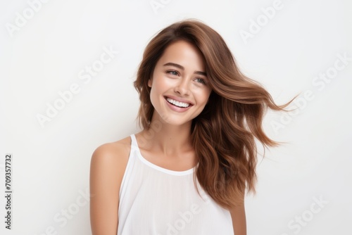 Portrait of beautiful young woman with long healthy hair. Studio shot.