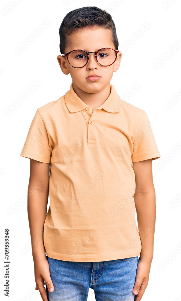 Little cute boy kid wearing casual clothes and glasses with serious expression on face. simple and natural looking at the camera. Little cute boy kid wearing casual clothes and glasses with serious expression on face. simple and natural looking at the camera.