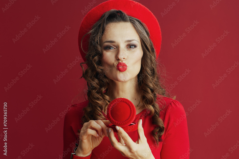 woman in dress and beret isolated on background sending kiss woman in dress and beret isolated on background sending kiss