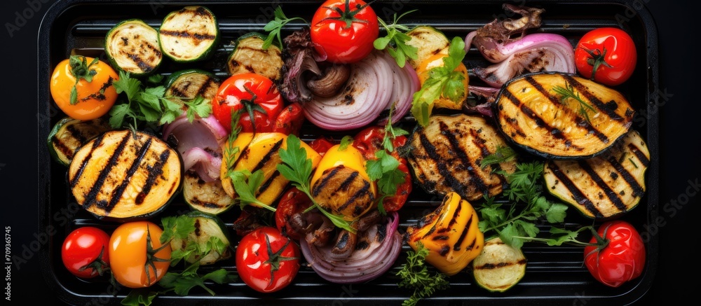 Grilled vegetables on electric grill, top view, space for text.