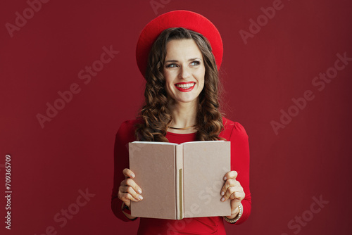 happy stylish woman in dress and beret against background