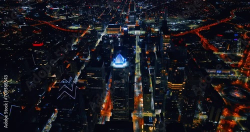 Stunning scenery of a gorgeous downtown of Philadelphia, Pennsylvania, USA. Drone footage rising above the panorama at night. photo