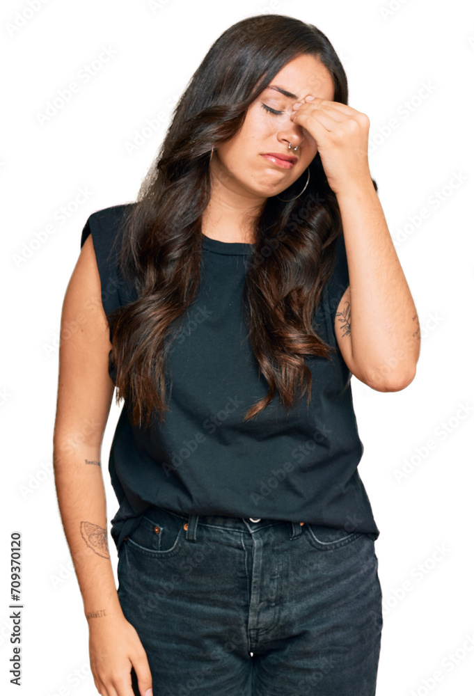 Beautiful brunette young woman wearing black shirt tired rubbing nose and eyes feeling fatigue and headache. stress and frustration concept. Beautiful brunette young woman wearing black shirt tired rubbing nose and eyes feeling fatigue and headache. stress and frustration concept.