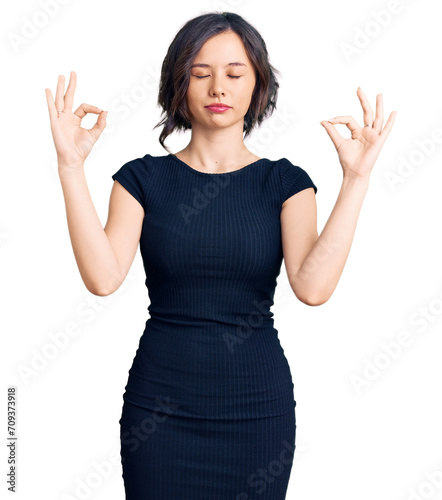 Young beautiful girl wearing casual clothes relax and smiling with eyes closed doing meditation gesture with fingers. yoga concept.