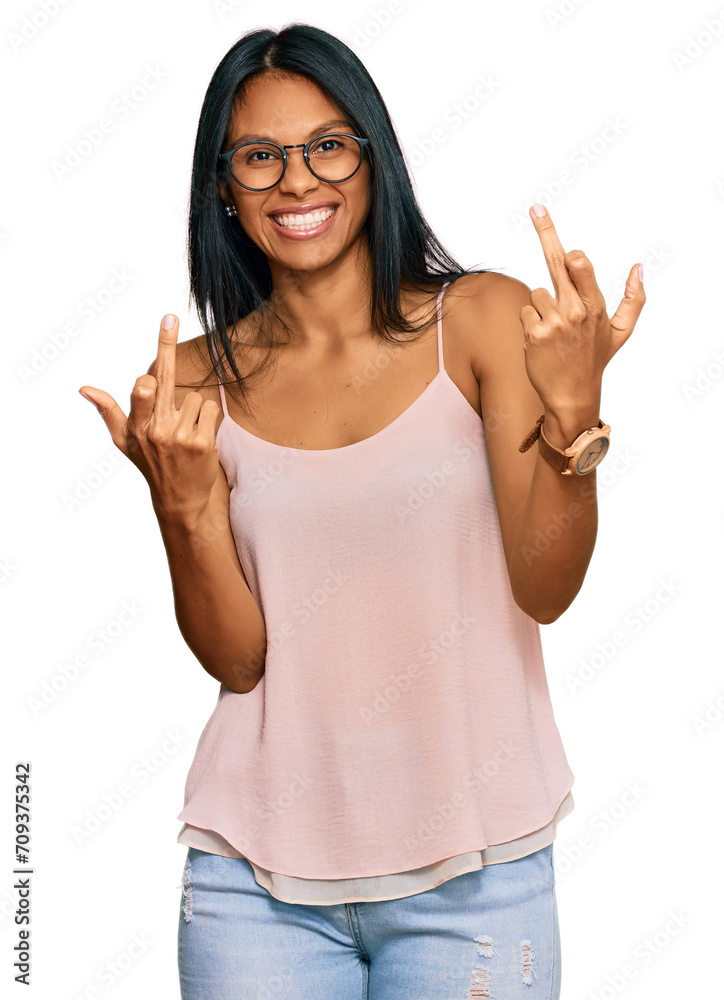 Young african american woman wearing casual clothes and glasses showing middle finger doing fuck you bad expression, provocation and rude attitude. screaming excited Young african american woman wearing casual clothes and glasses showing middle finger doing fuck you bad expression, provocation and rude attitude. screaming excited