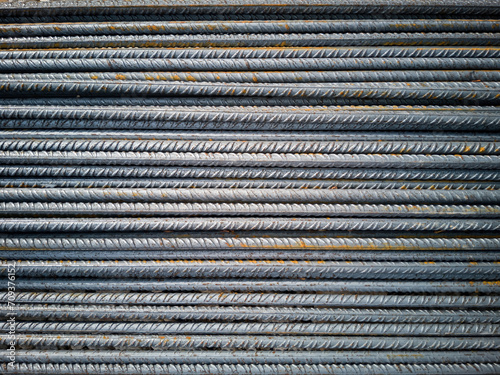 Background of horizontally aligned corrugated steel bars for construction with reinforced concrete