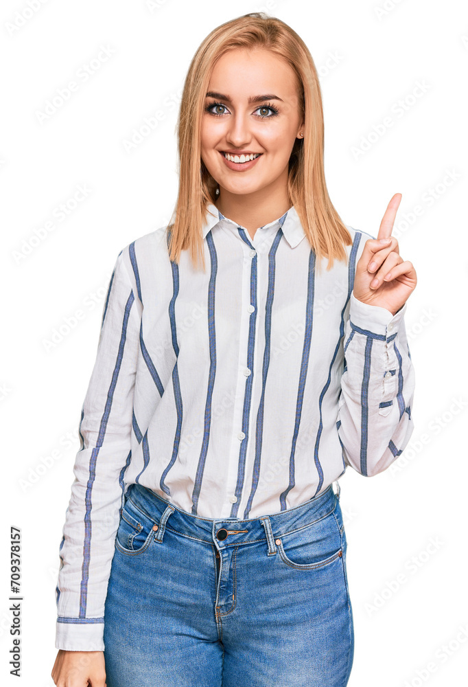 Beautiful caucasian woman wearing casual clothes showing and pointing up with finger number one while smiling confident and happy. Beautiful caucasian woman wearing casual clothes showing and pointing up with finger number one while smiling confident and happy.