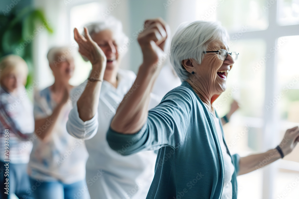 Candid capture of a joyful group of seniors showing vitality while dancing, highlights companionship and active lifestyle in retirement, reflecting the spirit of elderly - obrazy, fototapety, plakaty 