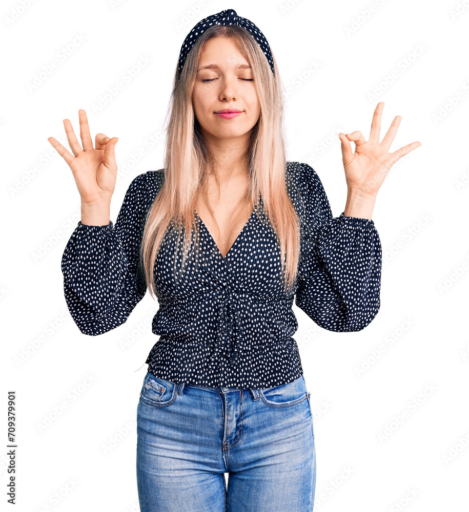 Young beautiful blonde woman wearing casual clothes relaxed and smiling with eyes closed doing meditation gesture with fingers. yoga concept. Young beautiful blonde woman wearing casual clothes relaxed and smiling with eyes closed doing meditation gesture with fingers. yoga concept.