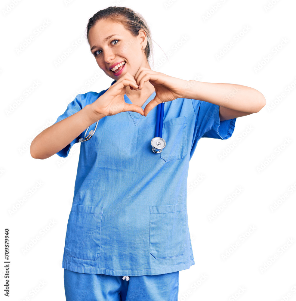 Young beautiful blonde woman wearing doctor uniform and stethoscope smiling in love doing heart symbol shape with hands. romantic concept. Young beautiful blonde woman wearing doctor uniform and stethoscope smiling in love doing heart symbol shape with hands. romantic concept.