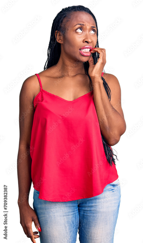 Young african american woman wearing casual clothes looking stressed and nervous with hands on mouth biting nails. anxiety problem.