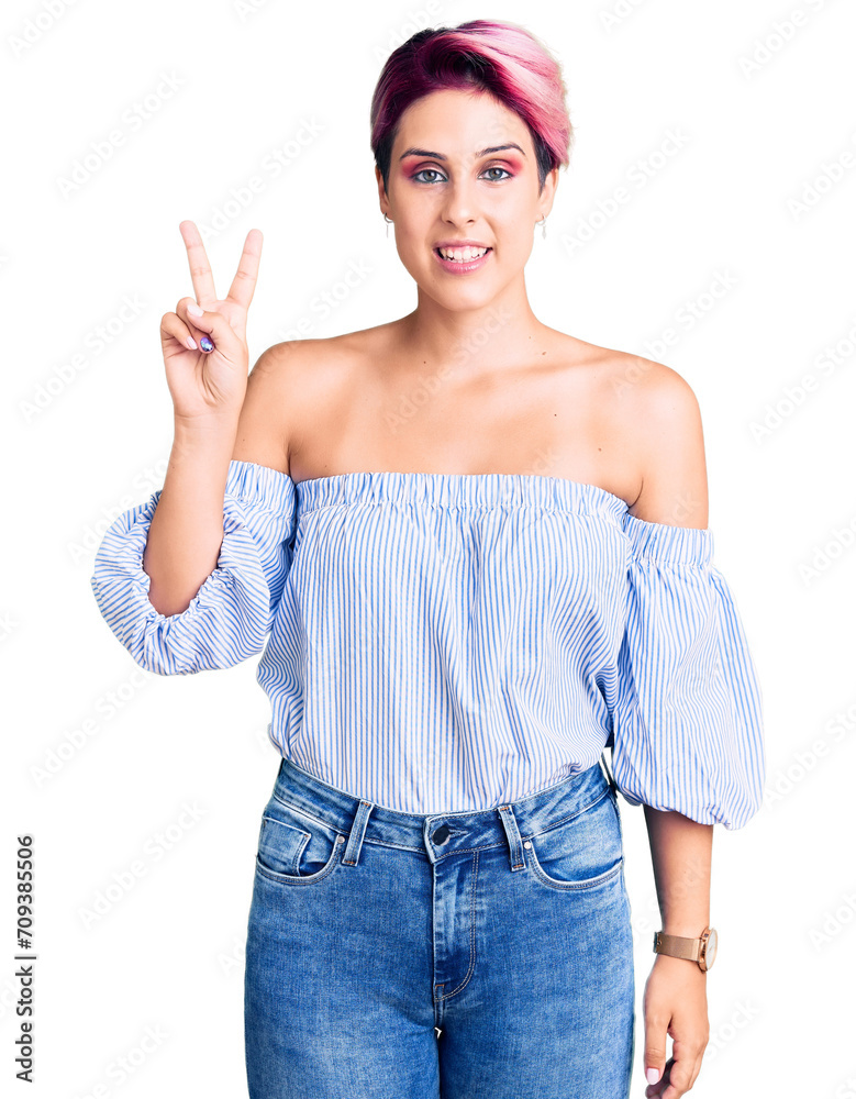 Young beautiful woman with pink hair wearing casual clothes smiling looking to the camera showing fingers doing victory sign. number two. Young beautiful woman with pink hair wearing casual clothes smiling looking to the camera showing fingers doing victory sign. number two.