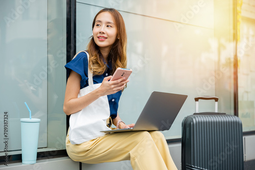 Slika na platnu A young woman travels the world while working remotely from her laptop