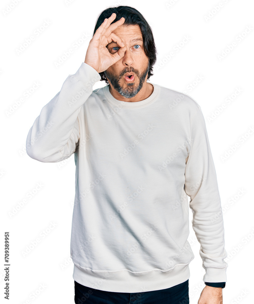 Middle age caucasian man wearing casual clothes doing ok gesture shocked with surprised face, eye looking through fingers. unbelieving expression. Middle age caucasian man wearing casual clothes doing ok gesture shocked with surprised face, eye looking through fingers. unbelieving expression.
