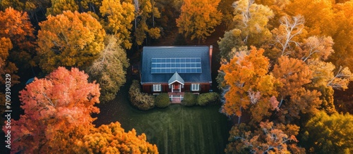 Fall evening aerial view of a green solar-powered house