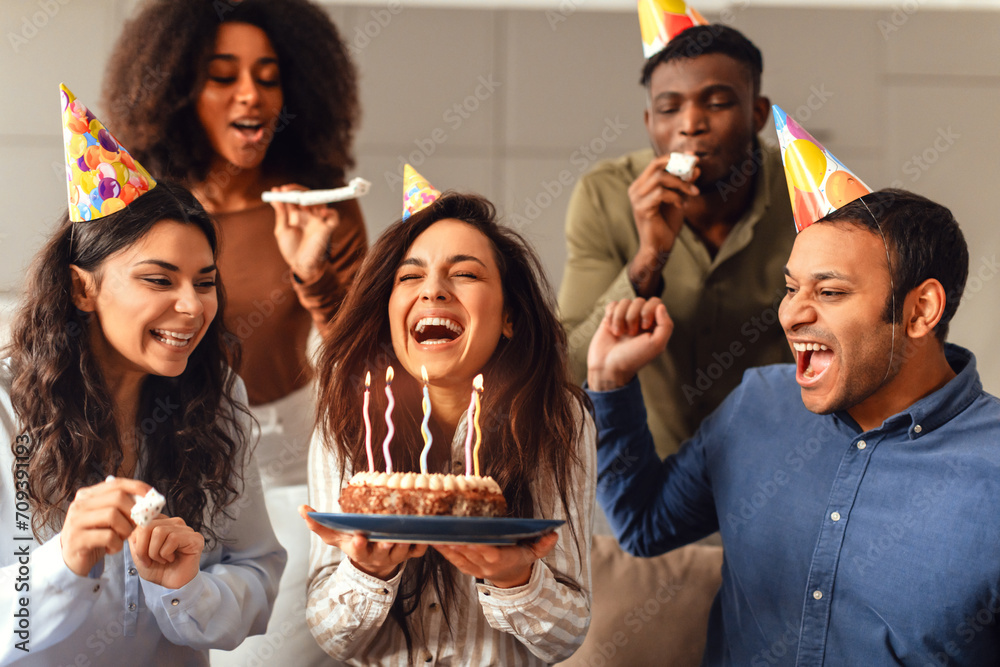 © Prostock-studio - Diverse friends united in birthday celebration enjoying party together indoors © Prostock-studio - Diverse friends united in birthday celebration enjoying party together indoors