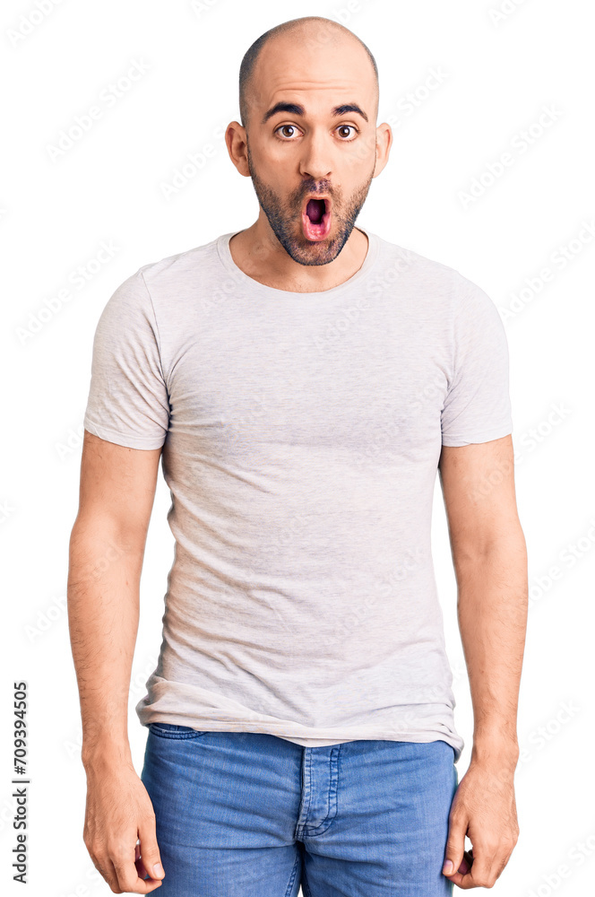 Young handsome man wearing casual t shirt afraid and shocked with surprise expression, fear and excited face. Young handsome man wearing casual t shirt afraid and shocked with surprise expression, fear and excited face.