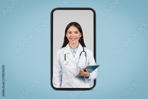 Telehealth concept with doctor in phone frame © Prostock-studio