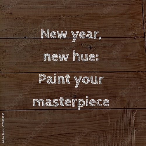 New year, new hue: Paint your masterpiece. Sign on a wooden background. Quote