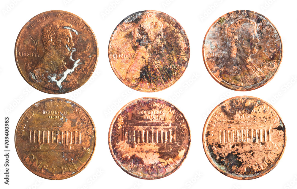 Isolated photo of old rusty worn american 1 cent coins on white background. Isolated photo of old rusty worn american 1 cent coins on white background.