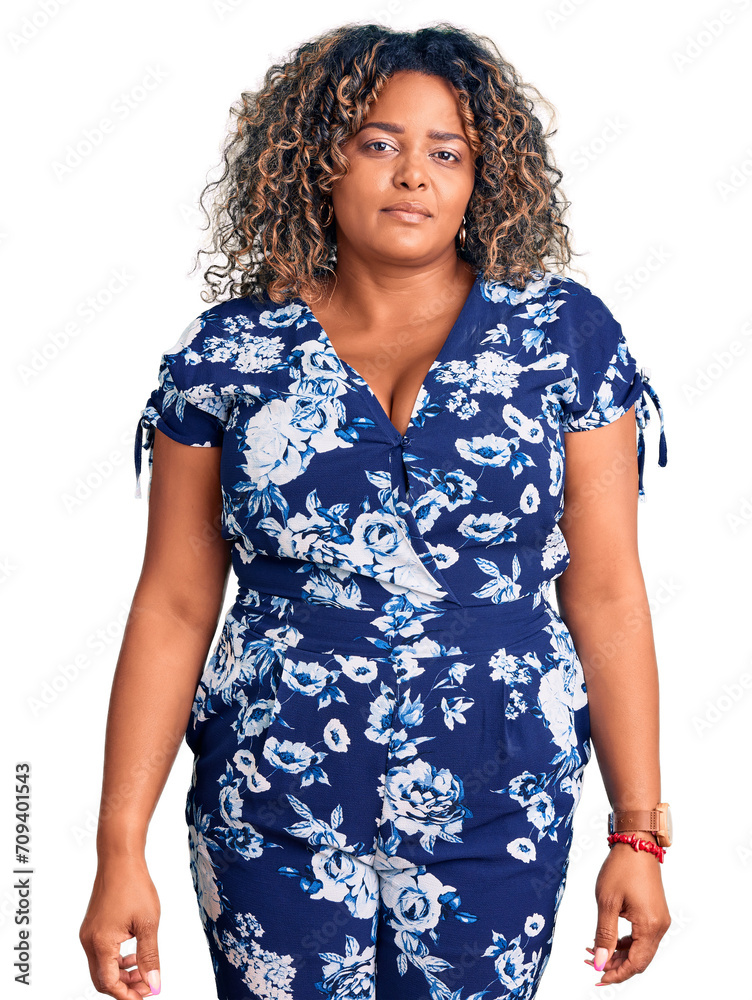 Young african american plus size woman wearing casual clothes relaxed with serious expression on face. simple and natural looking at the camera.