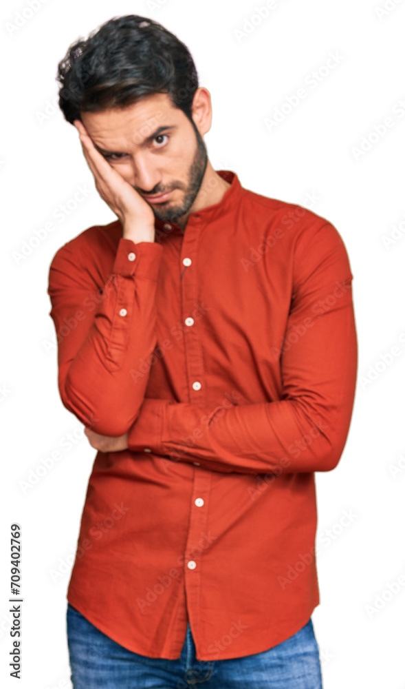 Young hispanic man wearing casual clothes thinking looking tired and bored with depression problems with crossed arms. Young hispanic man wearing casual clothes thinking looking tired and bored with depression problems with crossed arms.