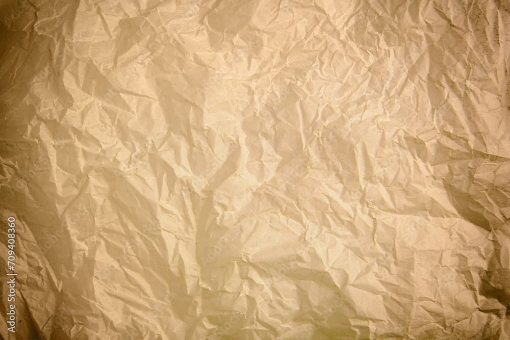 Fototapeta premium Crumpled old paper as background. Texture of parchment