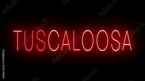 Flickering red retro style neon sign glowing against a black background for TUSCALOOSA photo