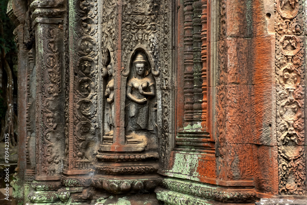 Fototapeta premium Apsara dancer carved in stone at Ta Prohm Temple, Siem Reap, Cambodia