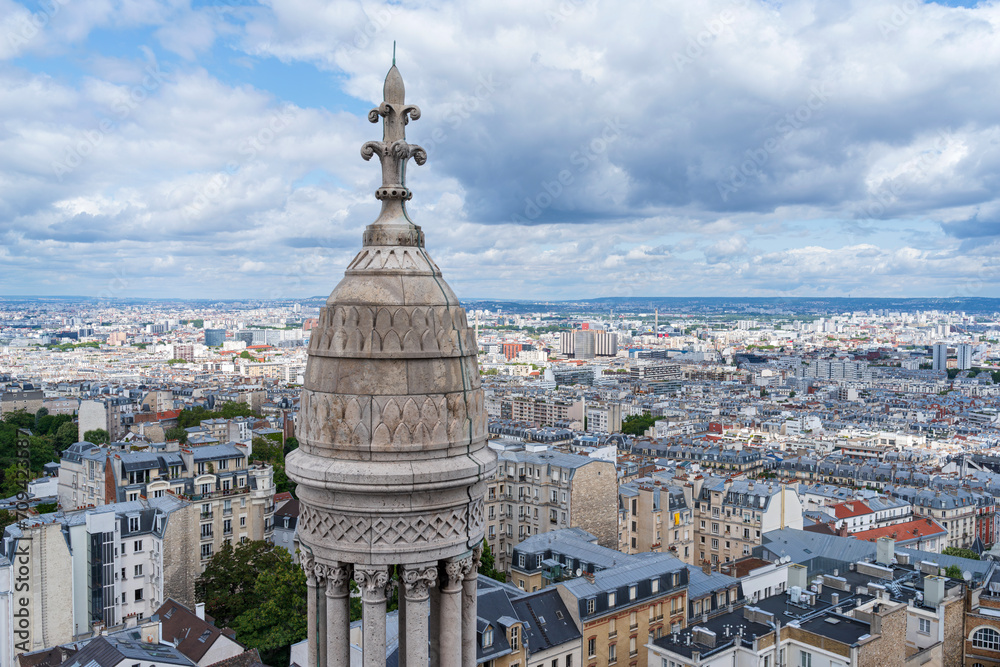 paris cityscape and cupola atop dome of sacred heart of jesus montmartre reaching above horizon