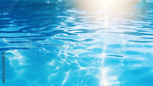 blue water surface with bright sunlight reflections