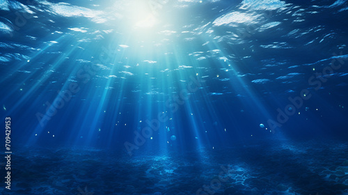perfectly seamless of deep blue ocean waves from underwater with sunlight
