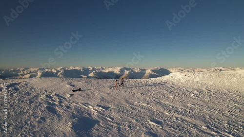 Family walking on mountain peak