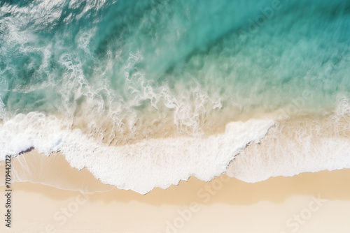 Aerial view of ocean on sandy beach, tropical island. Ocean background. Summer vacation or holiday. Seascape. 