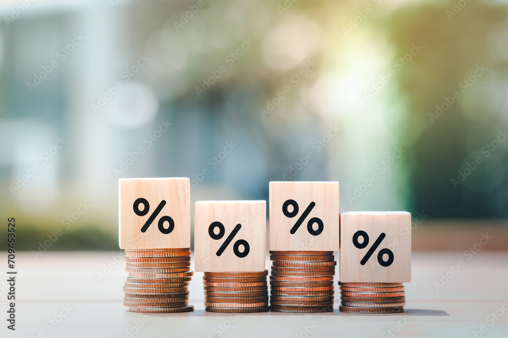 Interest rate finance and mortgage rates. Wooden block with percentage sign on many level of stack of coin. Financial growth, interest rate increase, inflation, sale price and tax rise concept. - obrazy, fototapety, plakaty 