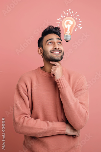 A thinking indian man with a lightbulb on his head