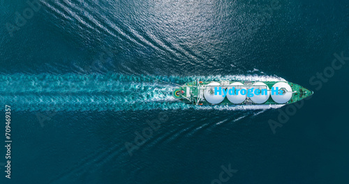 Liqiud Hydrogen renewable energy in vessel H2 hydrogen gas green energy . Hydrogen tanker ship. Red H2 Tanker runing in the ocean sea. petroleum ship transportation import export green environment. © Yellow Boat