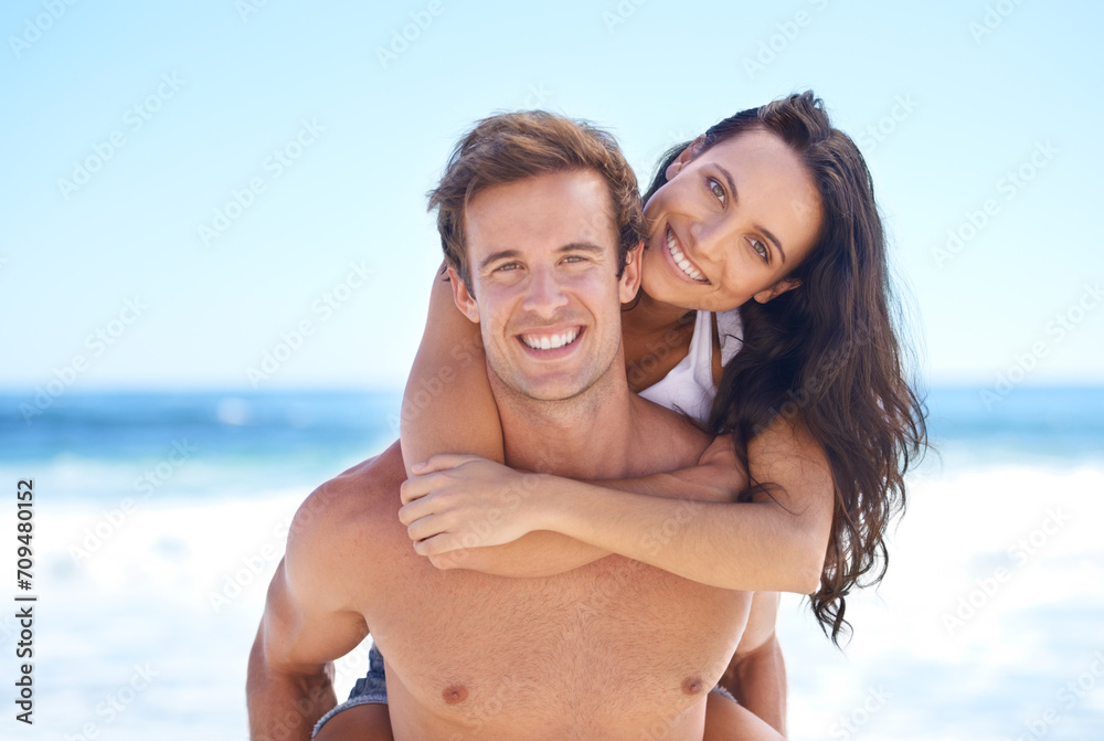 Portrait, hug and happy couple on beach for holiday adventure together on tropical island with blue sky. Smile, man and woman on ocean vacation with waves, embrace and piggy back on romantic travel. Portrait, hug and happy couple on beach for holiday adventure together on tropical island with blue sky. Smile, man and woman on ocean vacation with waves, embrace and piggy back on romantic travel.