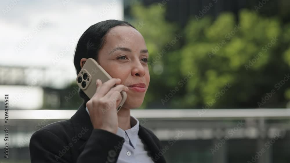 Happy Smiling Office Worker Talking on Phone Discussion Problems, while Walking Outside Before Work. Young Businesswoman on a Phone Call Having a Conversation. People and Technology Concept Happy Smiling Office Worker Talking on Phone Discussion Problems, while Walking Outside Before Work. Young Businesswoman on a Phone Call Having a Conversation. People and Technology Concept
