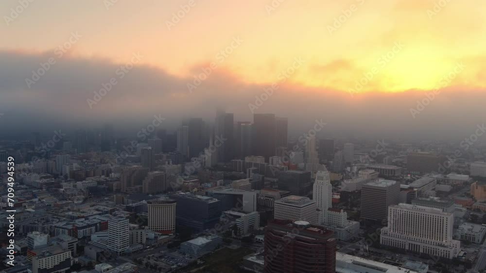 Serene aerial view of a foggy Los Angeles skyline at golden hour Serene aerial view of a foggy Los Angeles skyline at golden hour