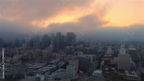 Panning aerial shot of sprawling Los Angeles skyline at golden hour