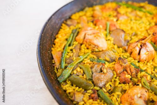 Close-up of a traditional Valencian paella with various ingredients.
