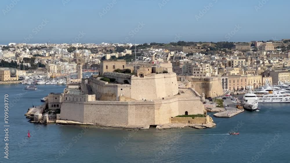 4K Handheld Shot of Fort St. Angelo: A Majestic Fortress with Baroque Architecture, Guarding Vittoriosa City; Filmed from Barrakka, Valetta, Malta. Centuries of History. UNESCO heritage site 4K Handheld Shot of Fort St. Angelo: A Majestic Fortress with Baroque Architecture, Guarding Vittoriosa City; Filmed from Barrakka, Valetta, Malta. Centuries of History. UNESCO heritage site