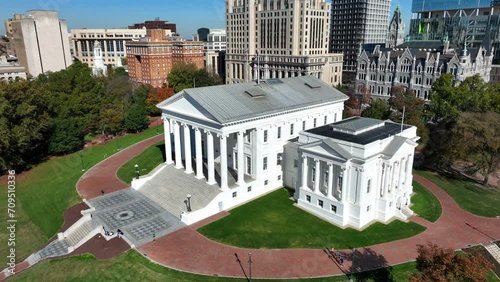 Virginia state capitol building in downtown Richmond, VA. Aerial descending shot towards ornate white government building with pillars. photo