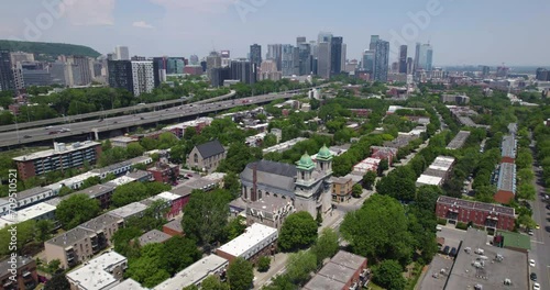 Aerial view orbiting the St. Cunigunde Church, summer day in Montreal, Canada photo