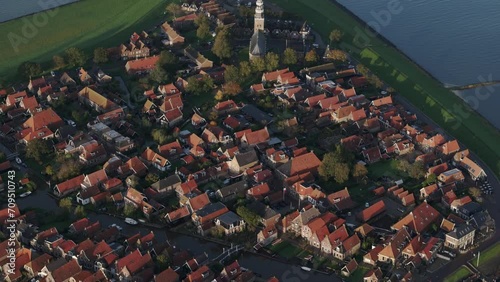 Aerial drone view of small village with orange roofs, Hindeloopen, Friesland photo